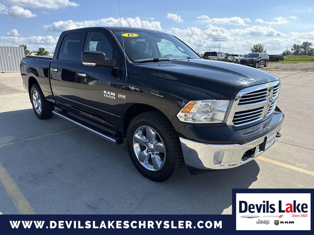 2015 RAM 1500 SLT in Black — front three-quarter view
