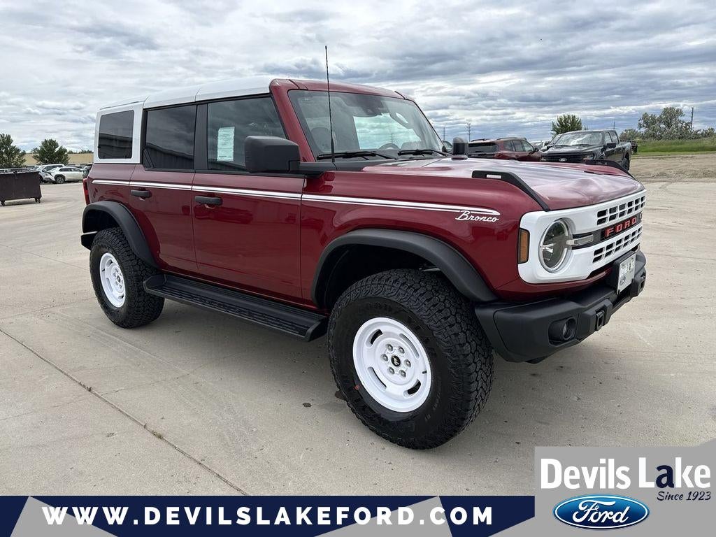 2026 Ford Bronco Heritage Edition in Ruby Red Metallic Tinted Clearcoat — front three-quarter view