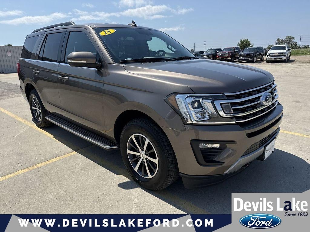 2018 Ford Expedition XLT in Stone Gray Metallic — front three-quarter view