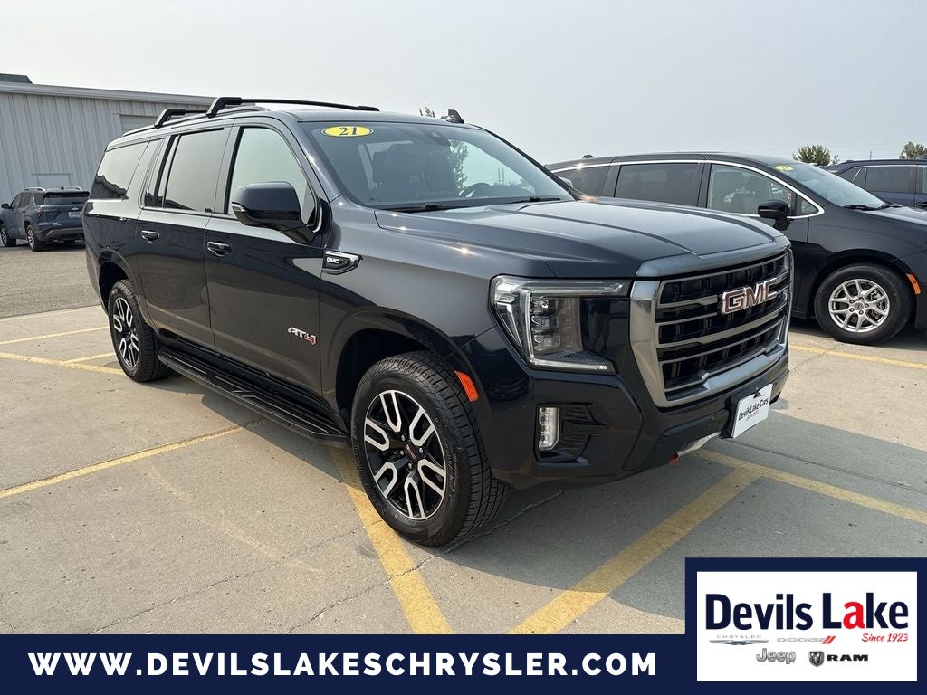 2021 GMC Yukon XL AT4 in Midnight Blue Metallic — front three-quarter view