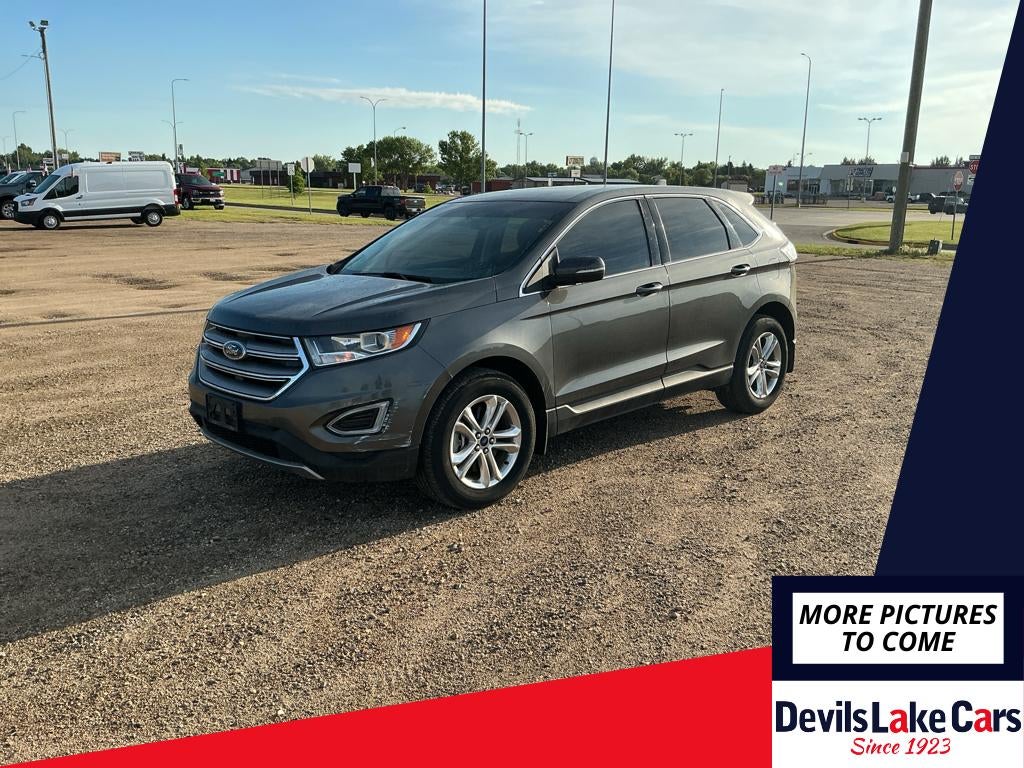 2016 Ford Edge SEL in Magnetic Metallic — front three-quarter view